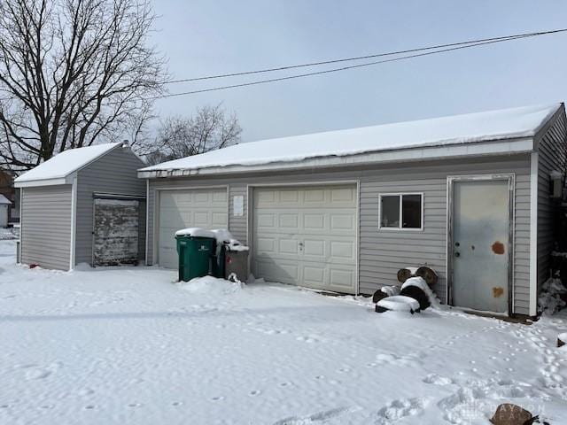 view of snow covered garage