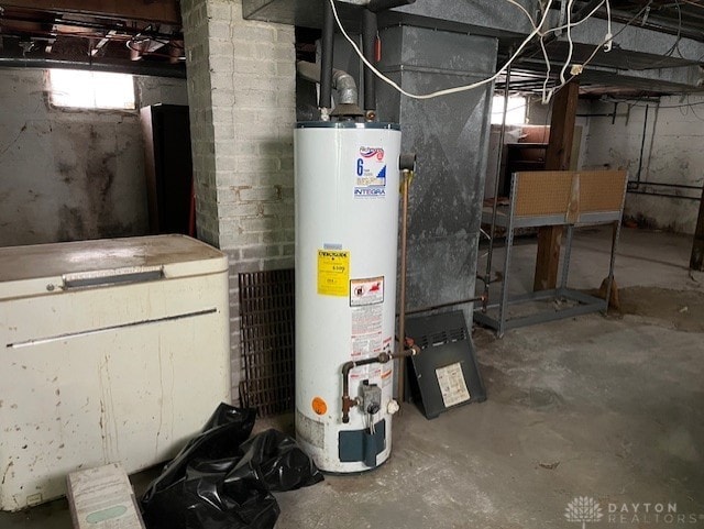 utility room with water heater