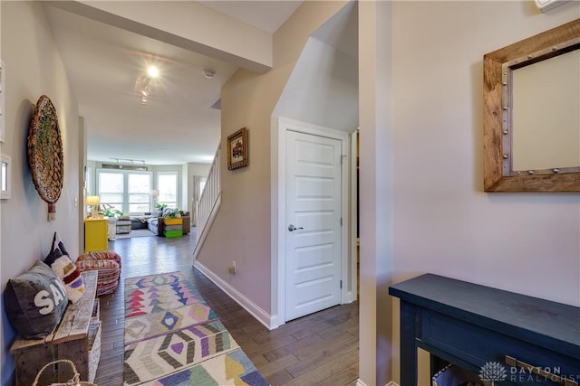 corridor with dark hardwood / wood-style floors