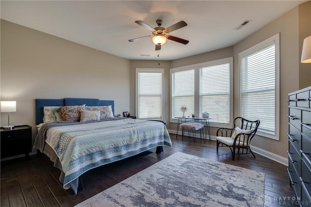 bedroom featuring ceiling fan and dark hardwood / wood-style floors