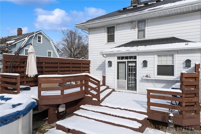 view of snow covered deck