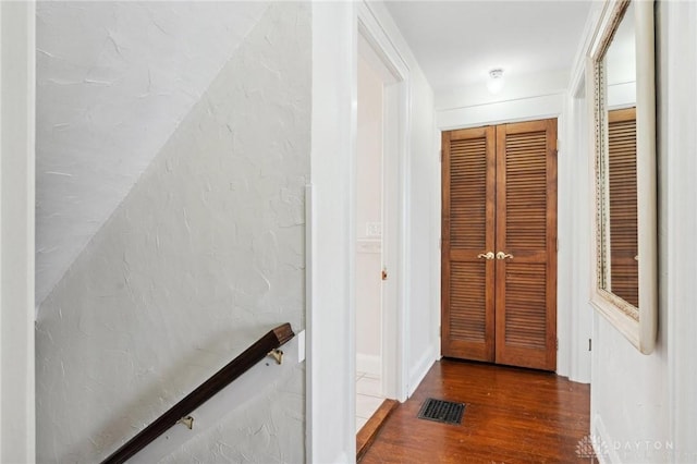 hallway with wood-type flooring