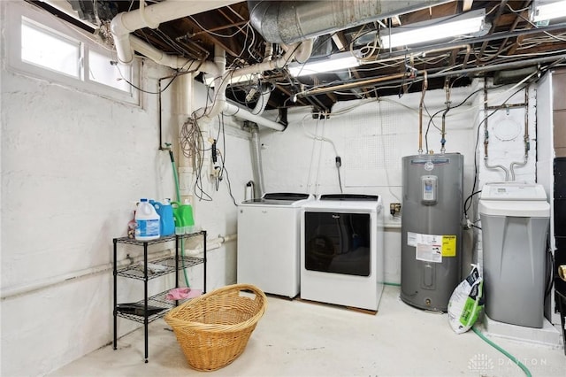 washroom featuring independent washer and dryer and water heater