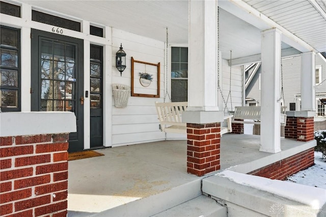 doorway to property with covered porch