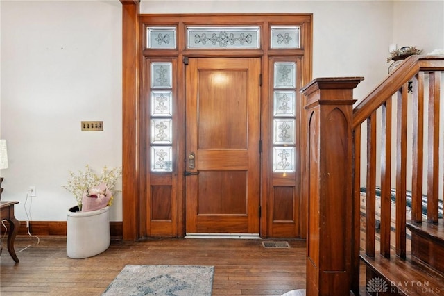 entrance foyer featuring dark hardwood / wood-style floors