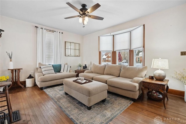 living room featuring ceiling fan and wood-type flooring