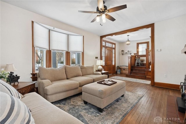 living room with hardwood / wood-style floors and ceiling fan