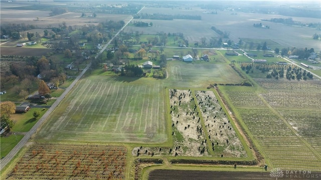 birds eye view of property with a rural view