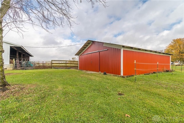 view of outdoor structure featuring a yard