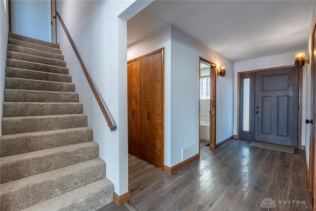 foyer entrance featuring dark hardwood / wood-style floors