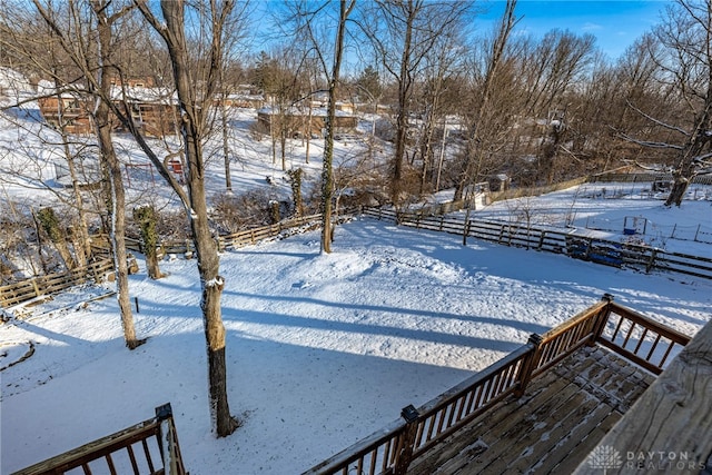 view of yard layered in snow