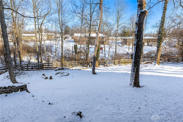 view of yard layered in snow