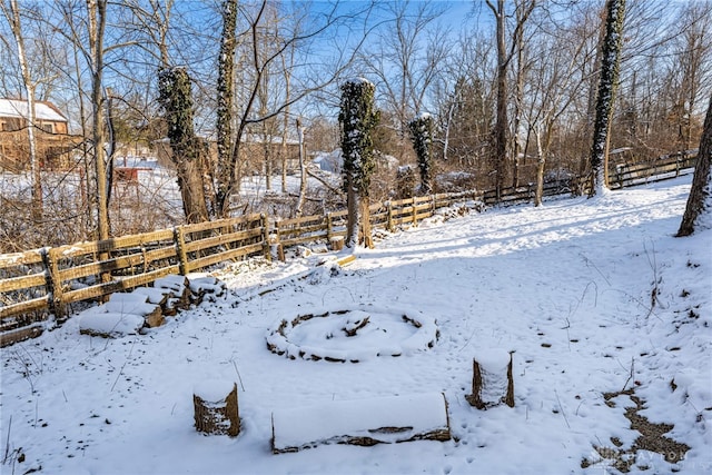 view of yard layered in snow