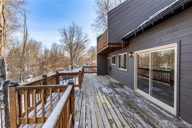 view of snow covered deck