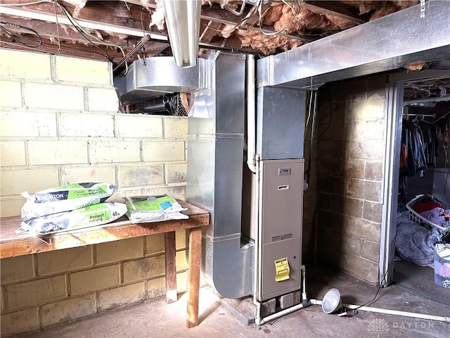 utility room featuring heating unit