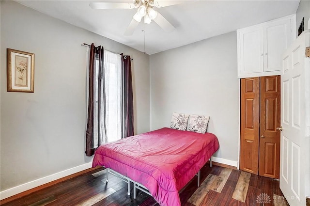 bedroom featuring dark hardwood / wood-style floors and ceiling fan