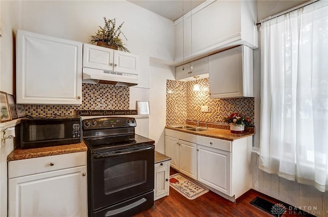 kitchen featuring white cabinets, sink, black appliances, and dark wood-type flooring