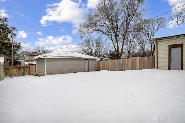 snowy yard with an outdoor structure