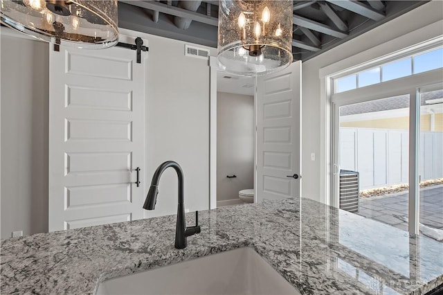 bathroom featuring sink and toilet