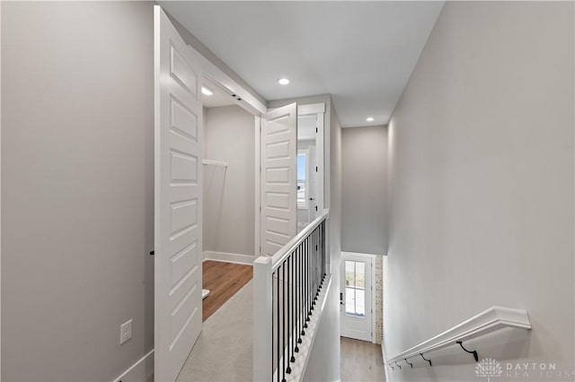 stairs with wood-type flooring