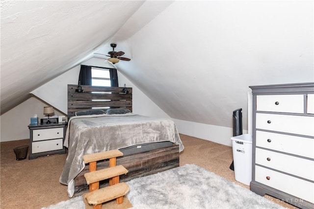 carpeted bedroom with lofted ceiling and ceiling fan