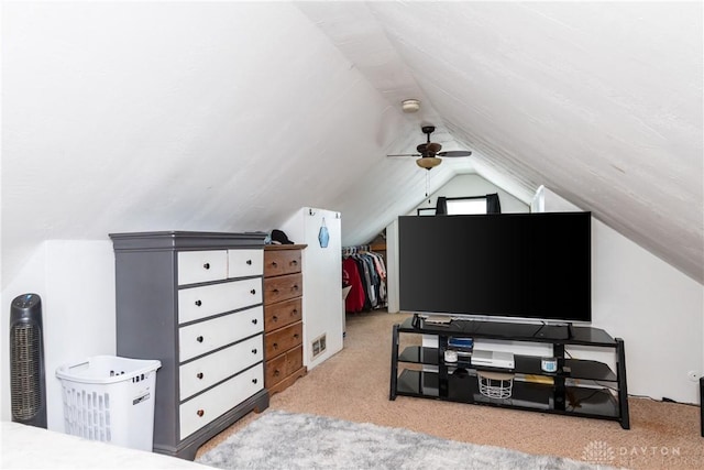 additional living space featuring ceiling fan, vaulted ceiling, and light colored carpet