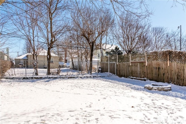 view of yard layered in snow