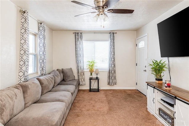 1908 John Glenn Rd, Dayton, OH 45420 - living area with baseboards, a textured ceiling, ceiling fan, and light carpet