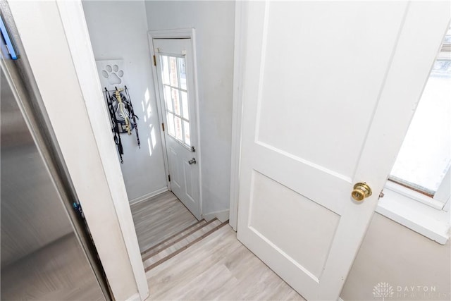 entryway with light hardwood / wood-style floors