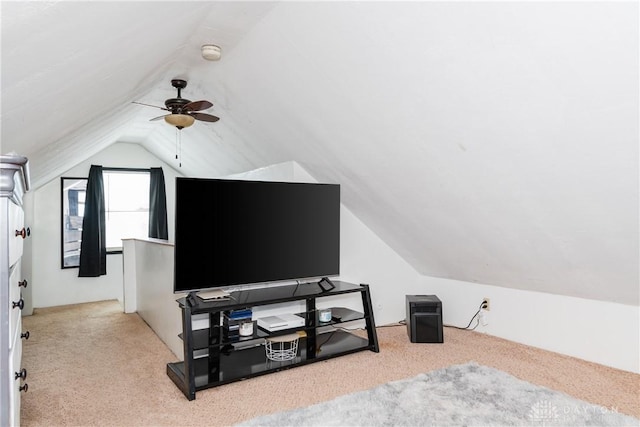 additional living space with light carpet, vaulted ceiling, and ceiling fan