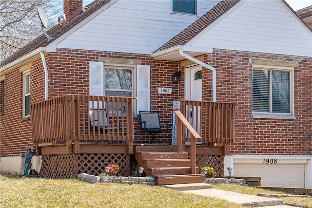 1908 John Glenn Rd, Dayton, OH 45420 - view of front of house featuring brick siding, a chimney, and a deck