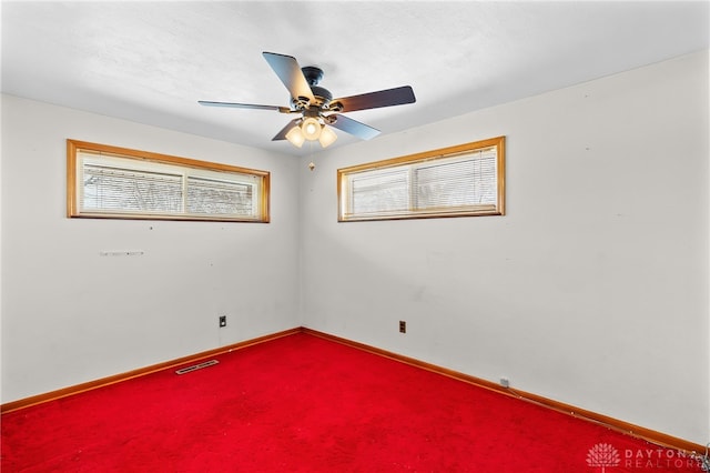 unfurnished room featuring carpet flooring and ceiling fan