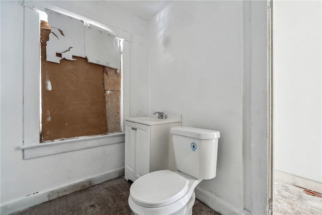 bathroom featuring toilet and vanity
