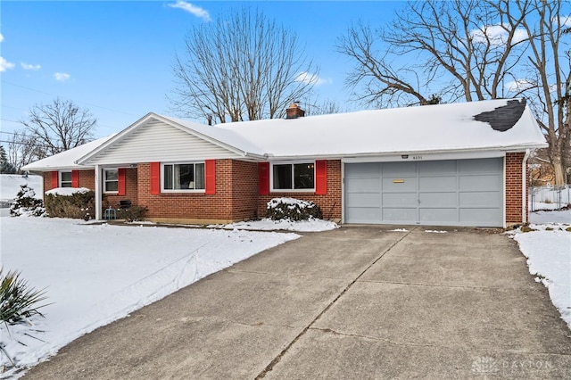 single story home featuring a garage