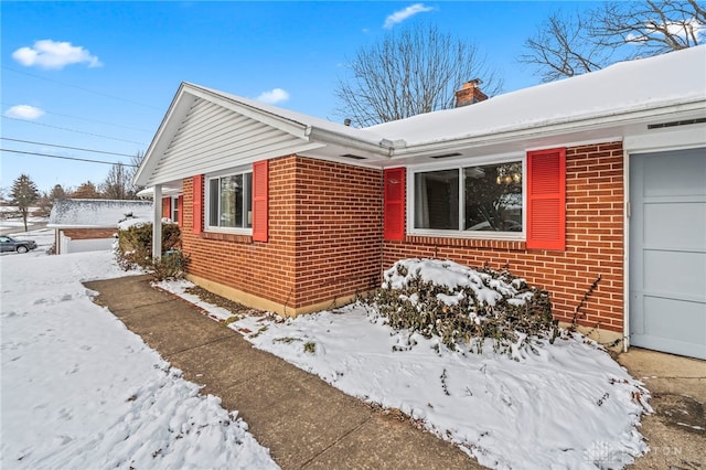 view of snow covered property