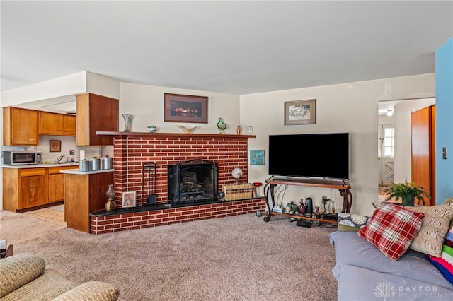 living room with light carpet and a fireplace