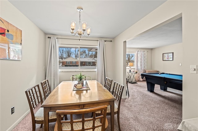 dining space with an inviting chandelier, pool table, and carpet flooring