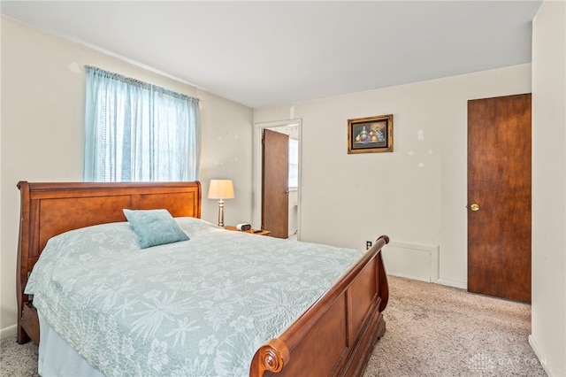 bedroom with light colored carpet