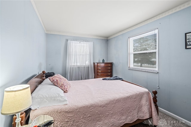 bedroom featuring multiple windows, carpet floors, and crown molding