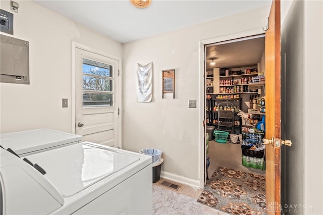 clothes washing area with washer and dryer