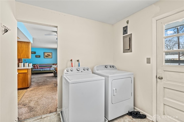 washroom with electric panel, washing machine and clothes dryer, and light colored carpet