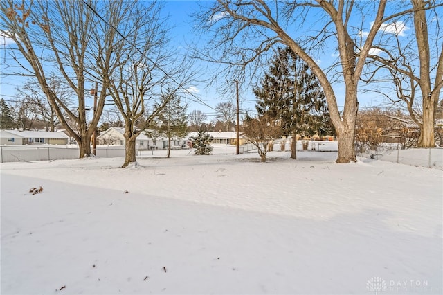 view of yard layered in snow