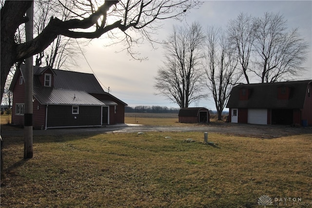 view of yard with a shed and a garage