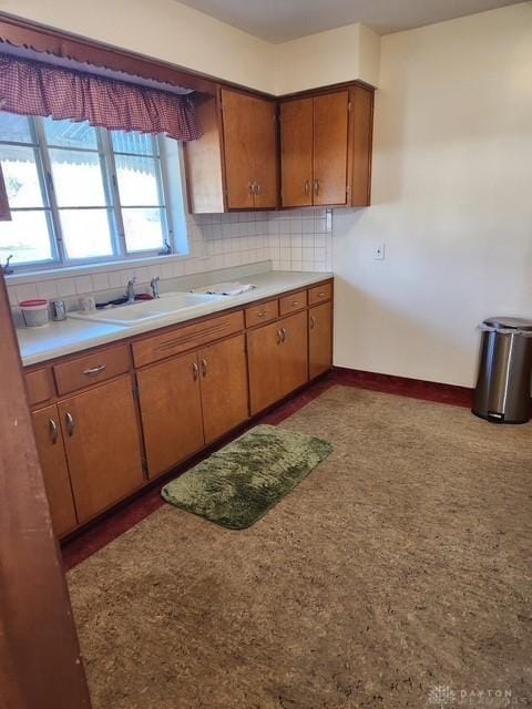 kitchen featuring sink and decorative backsplash