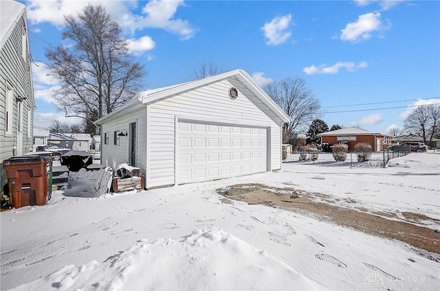 view of snow covered garage