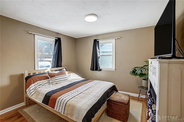 bedroom with light wood-type flooring