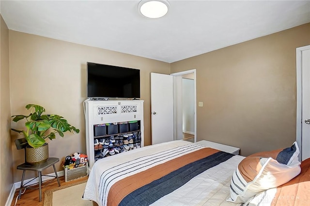 bedroom featuring hardwood / wood-style flooring