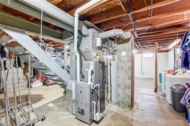 basement with washer and dryer and gas water heater