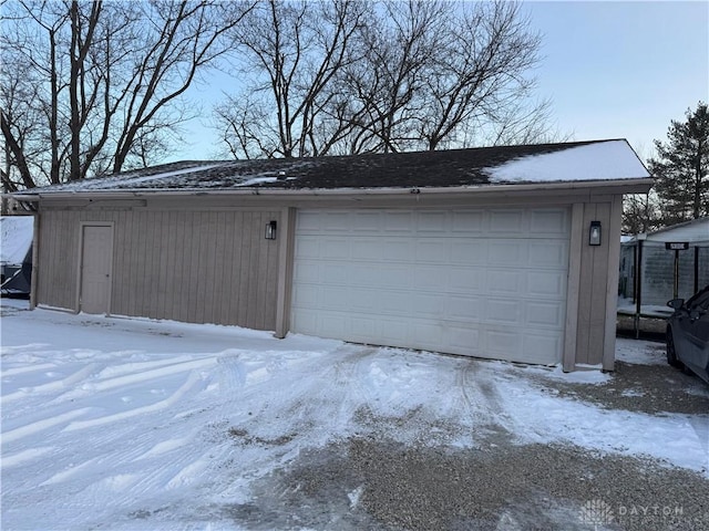 view of snow covered garage