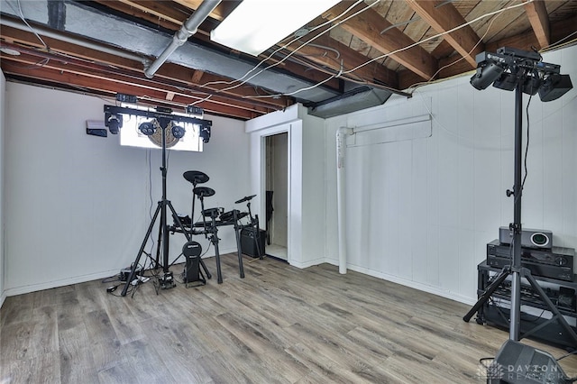 exercise room with hardwood / wood-style flooring